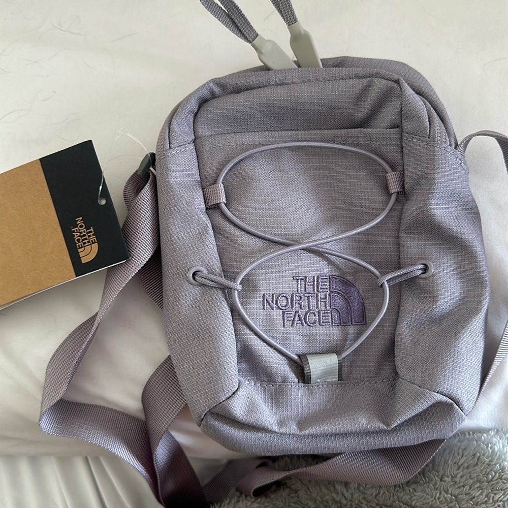 Tags attached purple north face bag